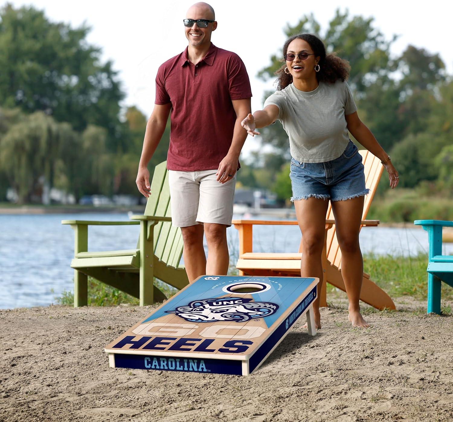 imageYouTheFan NCAA 2 x 4 Slogan Series Professional Wood Cornhole Game with Logo BagsNorth Carolina Tar Heels